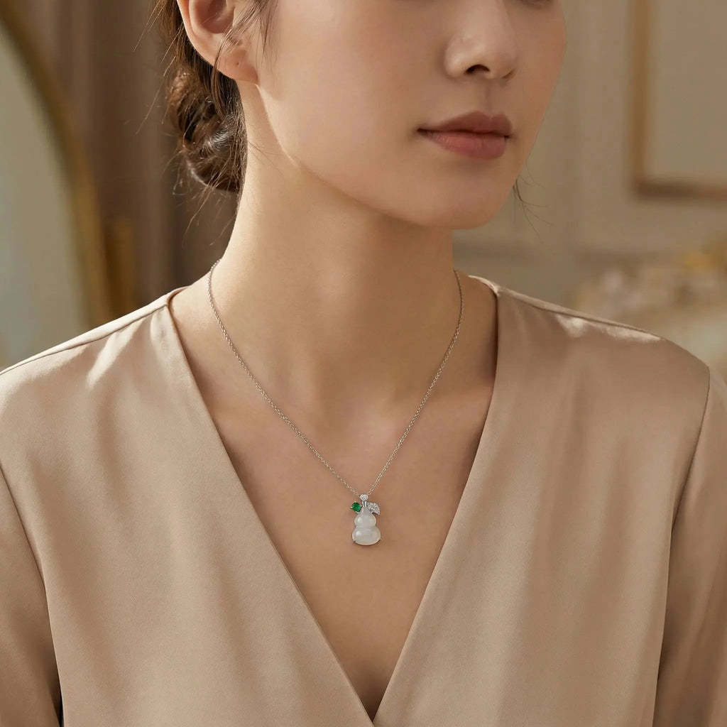 925 Sterling Silver Elegant Translucent White Hulu Pendant Necklace with Emerald and Diamond Accents NP Collection