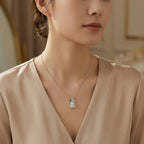 925 Sterling Silver Elegant Translucent White Hulu Pendant Necklace with Emerald and Diamond Accents NP Collection