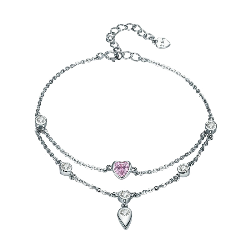 Silver bracelet with pink heart charm on a white background