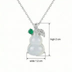 925 Sterling Silver Elegant Translucent White Hulu Pendant Necklace with Emerald and Diamond Accents NP Collection